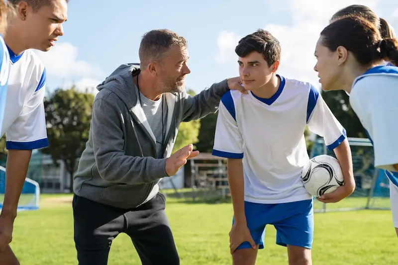 European players training with a U.S. college soccer coach.