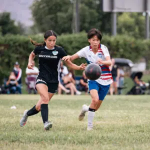 Girls playing for AYSO Section 1 Alliance in a competitive youth soccer pathway match